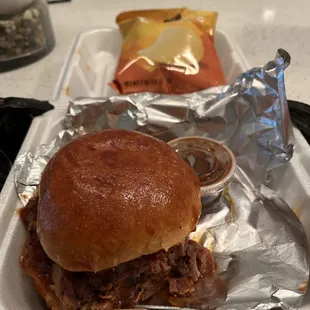 Brisket Sam'Mich, with chips included, and an extra side of barbecue sauce $13.95