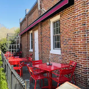 red tables and chairs outside