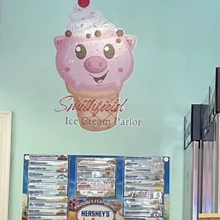 a pink ice cream cone with a cherry on top