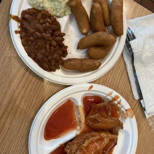 Barbecue chicken hush puppies potato salad and beans