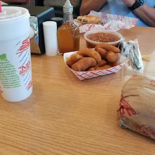 The classic: bbq sandwich, hushpuppies, baked beans, iced tea.