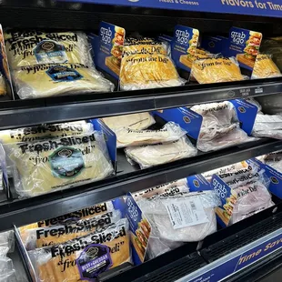 a display of cheeses and other foods