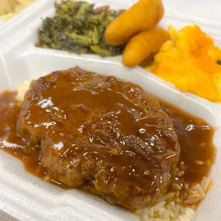 a meal in a styrofoam container