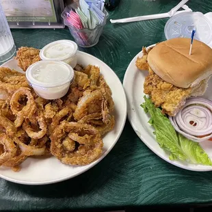 Half tenderloin sandwich and an appetizer of onion rings