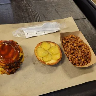 Double brisket cheeseburger with baked beans.