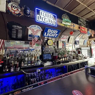 a bar with neon signs