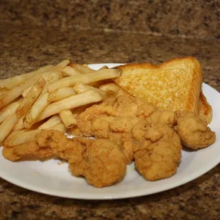 a plate of fried chicken and french fries