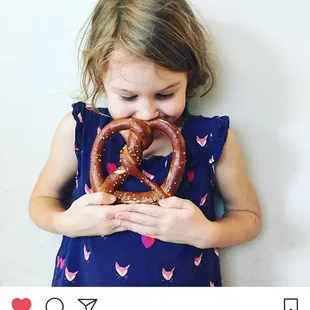 A young Smittybread fan and her pretzel.