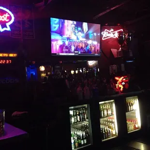 a bar with neon signs