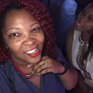 a woman with red hair and a woman with a ring on her finger