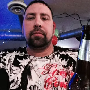 a man holding a beer