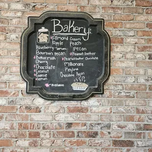 a menu on a brick wall