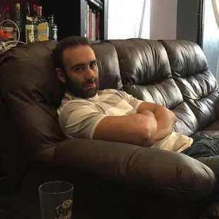 a man laying on a couch