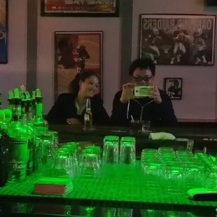 a woman sitting at a bar