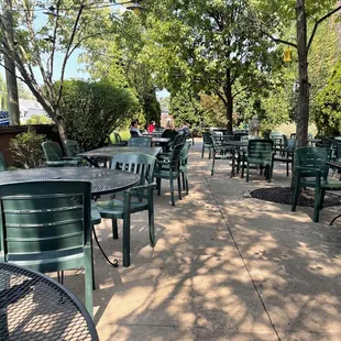 The tree shaded outdoor dining area