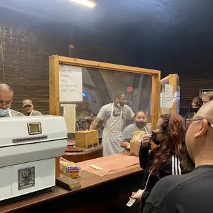 a group of people at a counter