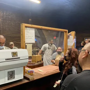 a group of people at a counter