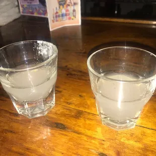 two glasses of water on a table