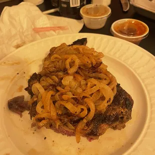Ribeye with sautéed onions and garlic butter