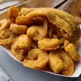 Fried shrimp, catfish, and fries in the seafood platter