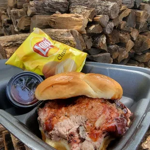 Pulled Pork BBQ sandwich, smoked with natural Oak Wood you see in photo.