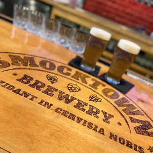 Close up of the bar with Lapdog Lagers in the background