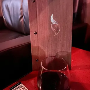 a glass of wine on a table