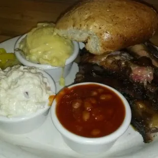 Smoked Ribs with bun,  potato salad,  coleslaw,  Bbq beans,  peppers and included is cobbler for dessert!