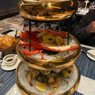 a three tiered platter of seafood