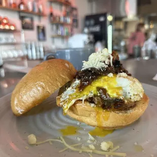 Brisket, over-medium egg, and cheese and a coffee con leche