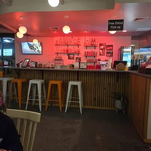 Inside bar seating and free donut pick-up area.