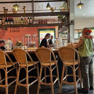 a man and a woman at a bar