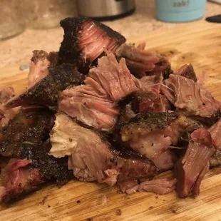 a pile of meat on a cutting board