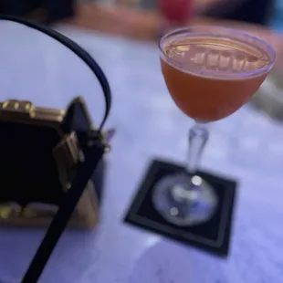 a drink in a glass on a table