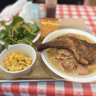 a plate of food and a bowl of macaroni and cheese