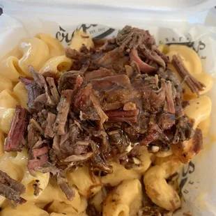 pulled pork and macaroni in a styrofoam container