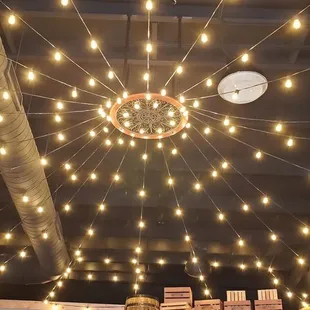 a ceiling with lights and a clock