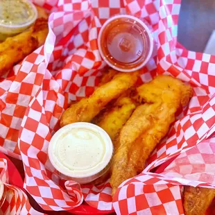 a basket of fish and fries