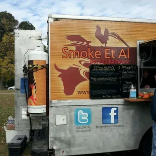 a man standing in front of a food truck