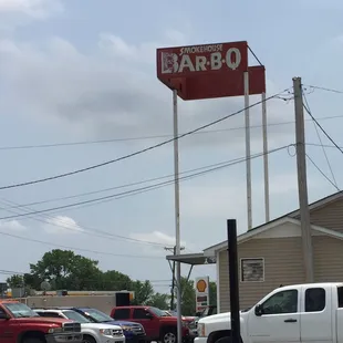 a white truck parked in front of the restaurant