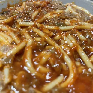 a bowl of spaghetti and meat