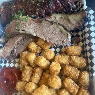 Brisket, ribs, tots. Brisket was tender and flavorful, ribs we were able to pull the bones right out.
