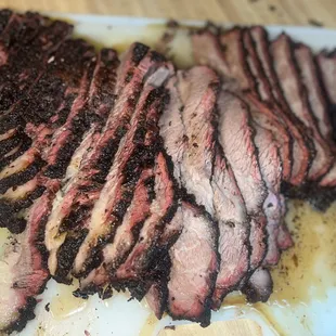 sliced beef on a cutting board