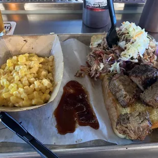 Two plate combo with burnt ends and pulled pork with a side of cheese corn.