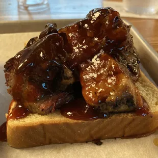 Burnt ends with bbq sauce on top