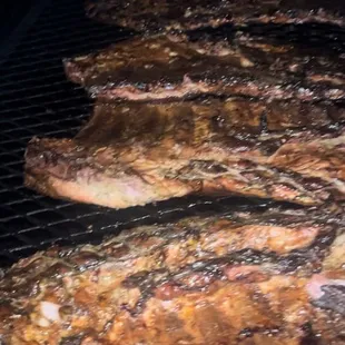 ribs cooking on a grill