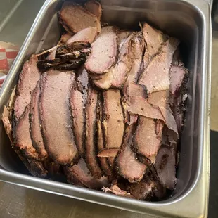 a pan of sliced meat