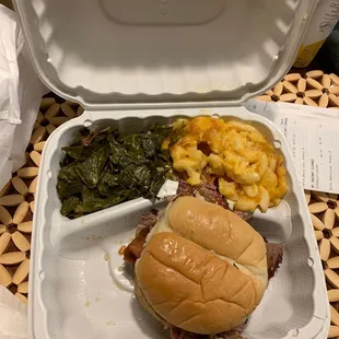 Brisket sandwich with Mac and cheese and collard greens