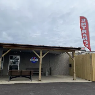 Entrance. Newly paved parking lot.
