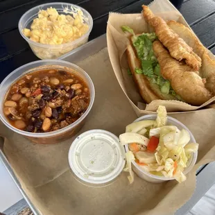 Walleye sandwich, coleslaw, baked beans, macaroni and cheese.